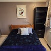 Photo 7: Cozy bedroom with lots of storage and bookshelves