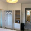 Photo 3: Double Bedroom 2: Cupboard with open shelving & laundry basket
