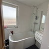 Photo 3: Bathroom with bath and shower