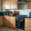Photo 7: Kitchen with many appliances and storage