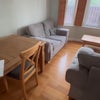 Photo 4: Shared living room (incl. projector, 2x 2-seater sofas, and a dining table with 4 chairs)