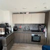 Photo 2: Fully durnished kitchen with oven, stove, fridge, freezer and dishwasher 