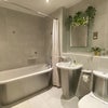 Photo 5: Elegant Main Bathroom With Bathtub