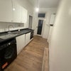 Photo 5: Kitchen, Shared kitchen with fitted cabinets and fridge freezer. Ample storage space for tenants.