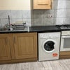 Photo 5: Kitchen sink,washing machine & cooker and oven 