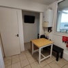 Photo 7: Kitchen with table and access to balcony