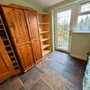 Photo 3: Double wardrobe, shelving. Slate floors
