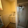 Photo 3: This is one of the bathrooms. Theres another with a bathtub  and a toilet. Theres never a cue!