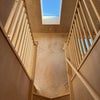 Photo 9: Loft staircase with skylight