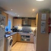 Photo 7: Kitchen includes 2in1 washer/dryer, dishwasher and lots of communal pans and crockery