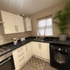 Photo 2: Kitchen with washer dryer and appliances