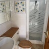 Photo 9: Downstairs toilet and shower