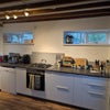 Photo 6: Kitchen with gas hobs, electric oven and large fridge/freezer
