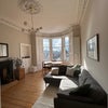 Photo 1: Living room with west facing bay window 