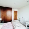 Photo 2: Bright double bedroom with bed and wardrobe. Desk & chair not included.