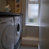 Photo 14: Separate Utility with sink, toilet, washing machine and tumble dryer