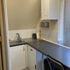 Photo 4: One end of galley kitchen