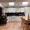 Photo 4: Downstairs, there is a modern, fully equipped kitchen facing the garden, providing a pleasant and pe