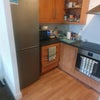 Photo 7: Kitchen accessible from living room. Shared fridge, freezer