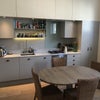 Photo 4: Shared open-plan kitchen including fridge, washing machine, dishwasher and oven 