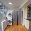 Photo 7: Washing Machine, Drier and 2 Tall Fridges in kitchen alcove