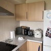 Photo 5: Fridge and cooking space