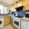 Photo 4: Kitchen with dishwasher, washer built in oven and gas hob, fridge freezer plus utility area with tum