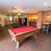 Photo 7: Common room with games including pool table and ping pong table 