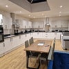 Photo 2: Shared kitchen and living space