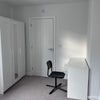 Photo 3: Desk, three-door wardrobe and door to ensuite