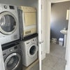 Photo 6: Laundry cupboard and downstairs shower