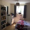 Photo 3: Room 1 - Double bed, chest of drawers and shelves. Window at both ends of the room. Room is 5m x 2.5