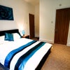 Photo 2: Furnishings include a double bed/mattress, wardrobe, chest of draws, bedside table, desk and chair.