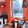 Photo 5: Bright functional kitchen with view over the garden