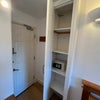 Photo 5: Bed 2 smaller cupboard with shelves