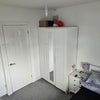 Photo 2: Bedroom with bed cupboard and storage area 