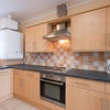 Photo 8: Communal kitchen cleaned weekly 