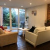 Photo 4: Shared living area facing garden