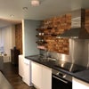 Photo 2: Central open plan kitchen facing rear