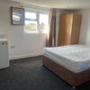 Photo 7: Double bed with ample space. Fridge in the room. 