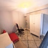 Photo 7: Second room (wooden desk + modern radiator has been added here recently not shown). There is a futon