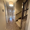 Photo 3: Entrance hall with downstairs toilet, new stair carpet and flooring 