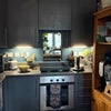 Photo 5: Kitchen with cooker, hob, microwave and washing machine