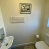 Photo 7: Down stairs toilet
