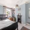 Photo 9: Quiet Bedroom With Feature Fireplace 