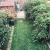 Photo 5: Garden with parking at the back 