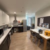 Photo 2: The shared kitchen is cleaned for free by staff every Monday.