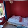 Photo 5: The bed consists of a comfy mattress placed on top of a sofa-bed.