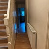 Photo 9: Stairwell and downstairs corridor