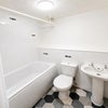 Photo 5: Power shower above bath